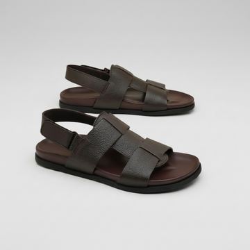 Pair of brown sandals on a white background